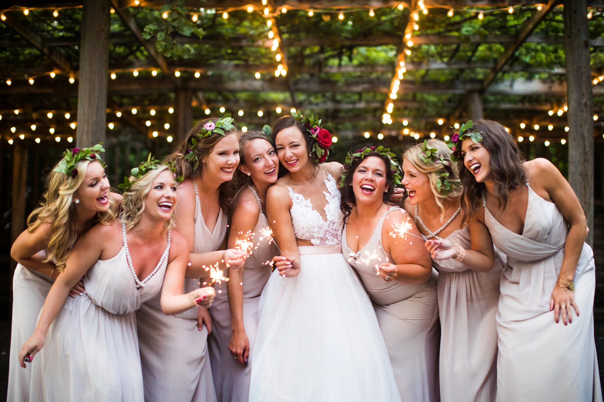 Bridal party celebrating with sparklers, wedding by Studio KH